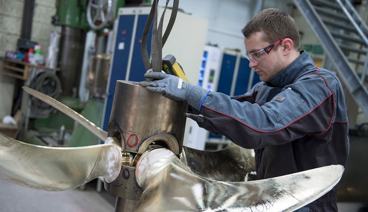 Employee with Servogear assembling a propeller